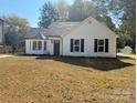 Lovely home with a bay window, black shutters and a well-maintained front yard at 4500 Doves Nest Ct, Matthews, NC 28105