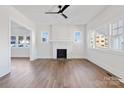 Spacious living room with hardwood floors, fireplace and ceiling fan at 103 2Nd Nw Ave, Hickory, NC 28601