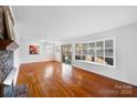 Spacious living room featuring hardwood floors and fireplace at 1727 Hartford Dr, Gastonia, NC 28052