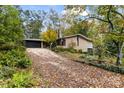 Ranch home with a long driveway and landscaping at 423 Whitestone Rd, Charlotte, NC 28270