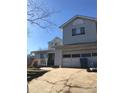 Two-story house with attached garage and driveway at 8540 Indian Summer Trl, Harrisburg, NC 28075