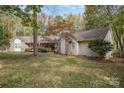 House exterior with stone accents and landscaping at 15450 Millview Trace Ln, Mint Hill, NC 28227