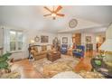 Bright living room features hardwood floors, vaulted ceilings, and abundant natural light at 15450 Millview Trace Ln, Mint Hill, NC 28227