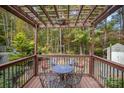 Cozy pergola with seating area, offering a shaded retreat in the backyard at 15450 Millview Trace Ln, Mint Hill, NC 28227