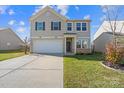 Two-story house with a driveway and landscaped yard at 173 Hidden Lakes Rd, Statesville, NC 28677