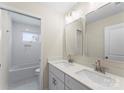 Modern bathroom featuring double sinks, a large mirror, and neutral walls at 1914 Irma St, Charlotte, NC 28216