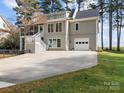 Two story house with attached garage and screened porch at 806 Lake Mist Dr, Stanley, NC 28164