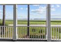 Relaxing porch overlooking scenic waterfront view at 806 Lake Mist Dr, Stanley, NC 28164