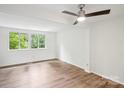 Bedroom with large windows and wood-look flooring at 9424 Lexington Cir # F, Charlotte, NC 28213