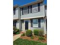 Charming two-story home with black shutters and well-maintained landscaping near the front door at 9424 Lexington Cir # F, Charlotte, NC 28213