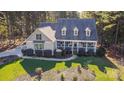 Aerial view of a house showcasing its size, landscaping, and location within a wooded area at 360 Lauren Pines Dr, York, SC 29745