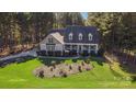 Aerial view showcasing the house's curb appeal and its setting in a tree-lined neighborhood at 360 Lauren Pines Dr, York, SC 29745