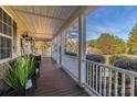 Spacious front porch with seating, white railings, and views of the surrounding landscape at 360 Lauren Pines Dr, York, SC 29745