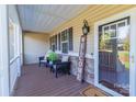 Inviting front porch with seating area, stylish decor, and a 'Welcome' sign at 360 Lauren Pines Dr, York, SC 29745