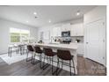 Modern kitchen with white cabinets, island, and stainless steel appliances at 362 Brinkley Dr # 142, Kings Mountain, NC 28086