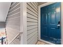 Blue front door with a modern handle and keyless entry at 513 N Graham St # 3D, Charlotte, NC 28202