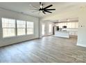 Spacious living room with wood-look floors and an open floor plan at 737 E Memorial Hwy, Harmony, NC 28634