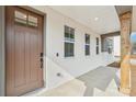 Charming front porch adorned with natural wood beams and a stylish door, enhancing the entryway's appeal at 809 Terra Dr, Tega Cay, SC 29708