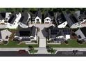 Aerial view of modern homes, some featuring solar panels, neatly arranged with well-manicured landscaping at 821 Terra Dr, Tega Cay, SC 29708