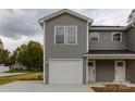 Two-story new construction townhome with gray siding, white trim and a two-car garage at 2014 Crown Point Dr # 2008-B, Albemarle, NC 28001