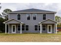 New construction gray townhome with covered entrances and well manicured landscaping at 2014 Crown Point Dr # 2008-B, Albemarle, NC 28001