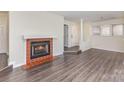 Spacious living room featuring hardwood floors and a cozy fireplace with traditional mantel at 1101 E Morehead St # 32, Charlotte, NC 28204