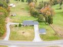 Aerial view of a ranch home on a spacious lot with a detached carport at 1926 Hopewell Church Rd, Sherrills Ford, NC 28673