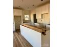 White kitchen cabinets and an island, ready for countertops at 1176 Greenheather Dr, Salisbury, NC 28147