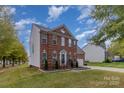 Beautiful brick home with a well-kept lawn, complementing the traditional architecture and design at 2512 Holly Oak Ln, Gastonia, NC 28056