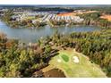 Stunning aerial shot of a home's location, showcasing waterfront views, a golf course, and the surrounding community at 25566 Seagull Dr, Lancaster, SC 29720