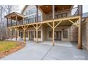 Spacious outdoor patio area with multiple doors leading into the home's lower level at 6630 Vesuvius Furnace Rd # 1, Denver, NC 28037