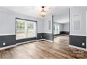 Spacious open living room with a large window and stylish wood floors, offering ample natural light at 3107 Balkan Dr, York, SC 29745