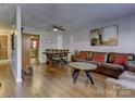 Open living and dining area with hardwood floors at 4609 Coronado Dr # O, Charlotte, NC 28212
