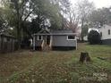 Backyard view of the home featuring the well-maintained lawn at 605 N Mcfarland N St, Gastonia, NC 28054