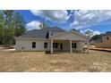 The home features a large backyard with a covered patio perfect for outdoor entertaining at 217 Heartland Dr, Rock Hill, SC 29732