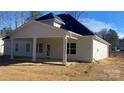 Rear exterior view of the home showing covered patio and ample backyard space at 217 Heartland Dr, Rock Hill, SC 29732