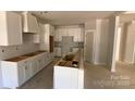 Spacious unfinished kitchen with white cabinetry awaiting countertops and appliances at 217 Heartland Dr, Rock Hill, SC 29732