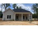 Home's back porch with stately white columns and neutral colored siding at 227 Heartland Dr, Rock Hill, SC 29732