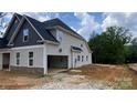 Exterior side view of the home featuring an attached garage and neutral siding at 227 Heartland Dr, Rock Hill, SC 29732