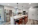 Bright kitchen with stainless steel appliances, a large center island, and stylish pendant lighting at 3018 Corinth Church Rd, Monroe, NC 28112