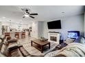 Open-concept living room with modern finishes, a fireplace, and a view of the kitchen area at 3018 Corinth Church Rd, Monroe, NC 28112