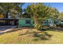 Front view of a green mobile home with carport at 3401 Stony Brook Cir, Newton, NC 28658