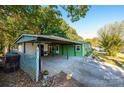 Carport and side view of green mobile home at 3401 Stony Brook Cir, Newton, NC 28658