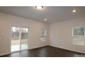 Bright dining room with sliding glass doors leading to a patio at 3540 Nimbell Rd, Monroe, NC 28110