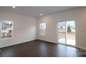 Bright dining area with sliding glass door leading to backyard at 3543 Nimbell Rd, Monroe, NC 28110