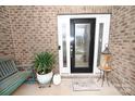 Welcoming front entrance with decorative glass door, side lights, and brick accents, creating curb appeal at 126 Fleming Dr, Statesville, NC 28677