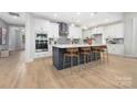 Beautiful kitchen with stainless steel appliances, island with barstool seating, and ample cabinet space at 3067 Trace Meadow Ct, York, SC 29745
