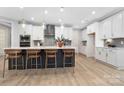 Beautiful kitchen with stainless steel appliances, island with barstool seating, and ample cabinet space at 3067 Trace Meadow Ct, York, SC 29745