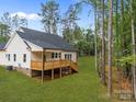 Back exterior view of home featuring a wooden deck perfect for entertaining at 315 Bonaventure Dr, Salisbury, NC 28147