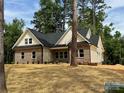 Attractive exterior of a brick home, set against a backdrop of lush trees at 315 Bonaventure Dr, Salisbury, NC 28147